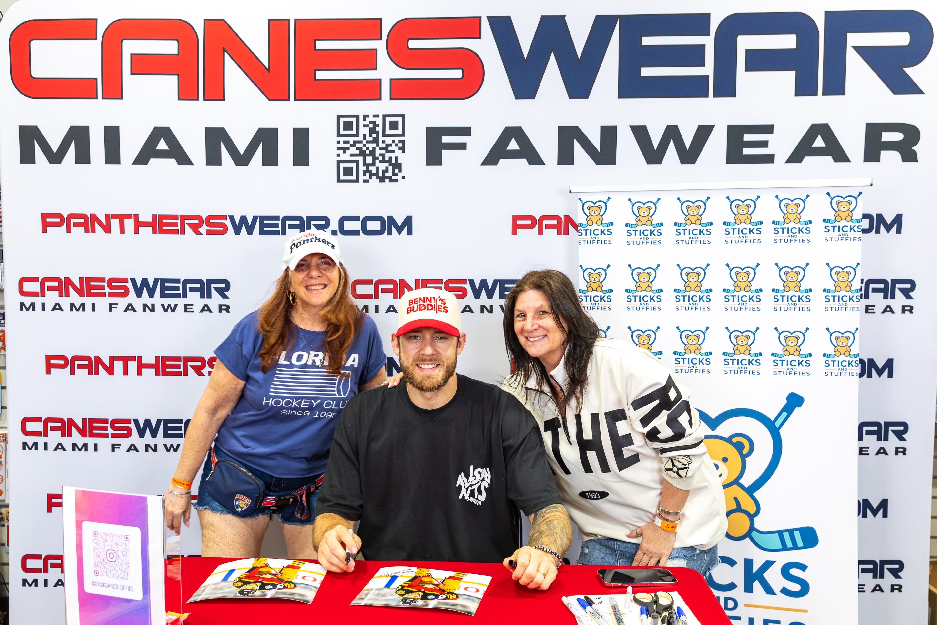 A.J. Greer with fans at the Sticks and Stuffies backdrop at CanesWear