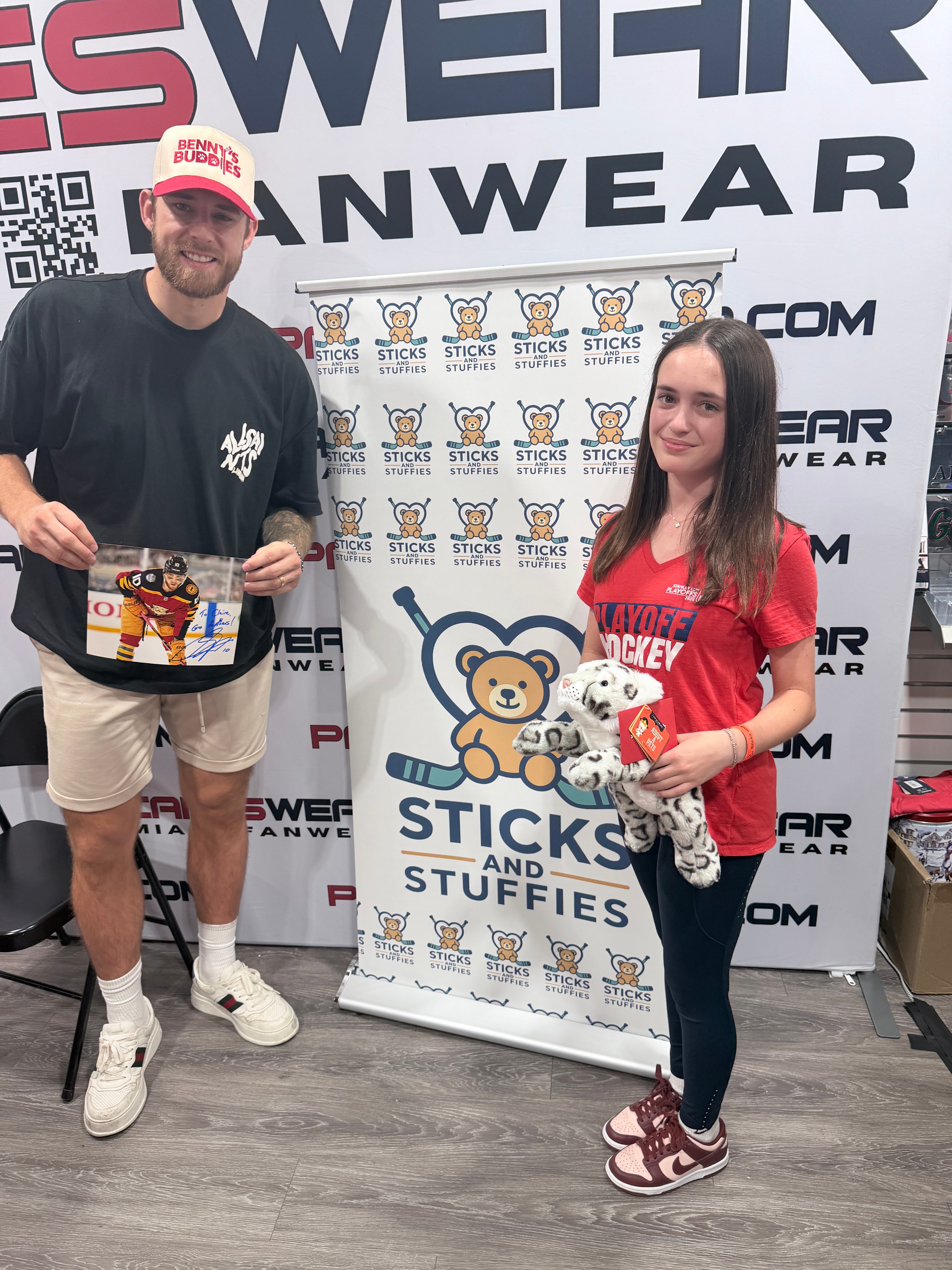A.J. Greer and Claire Goodman at the Sticks and Stuffies event booth at CanesWear in Davie, Florida