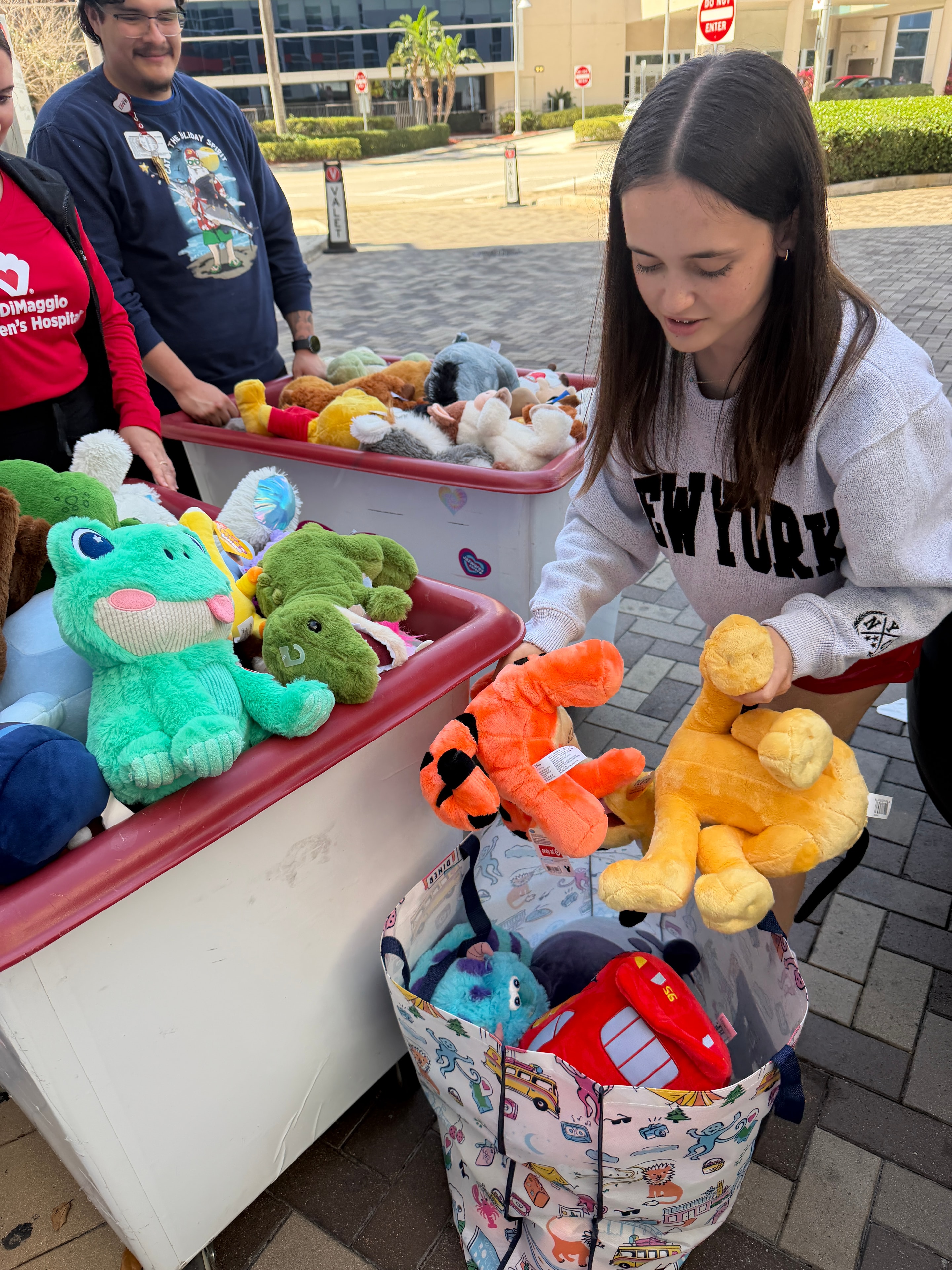 Claire Goodman with stuffed animals at Joe DiMaggio Children's Hospital