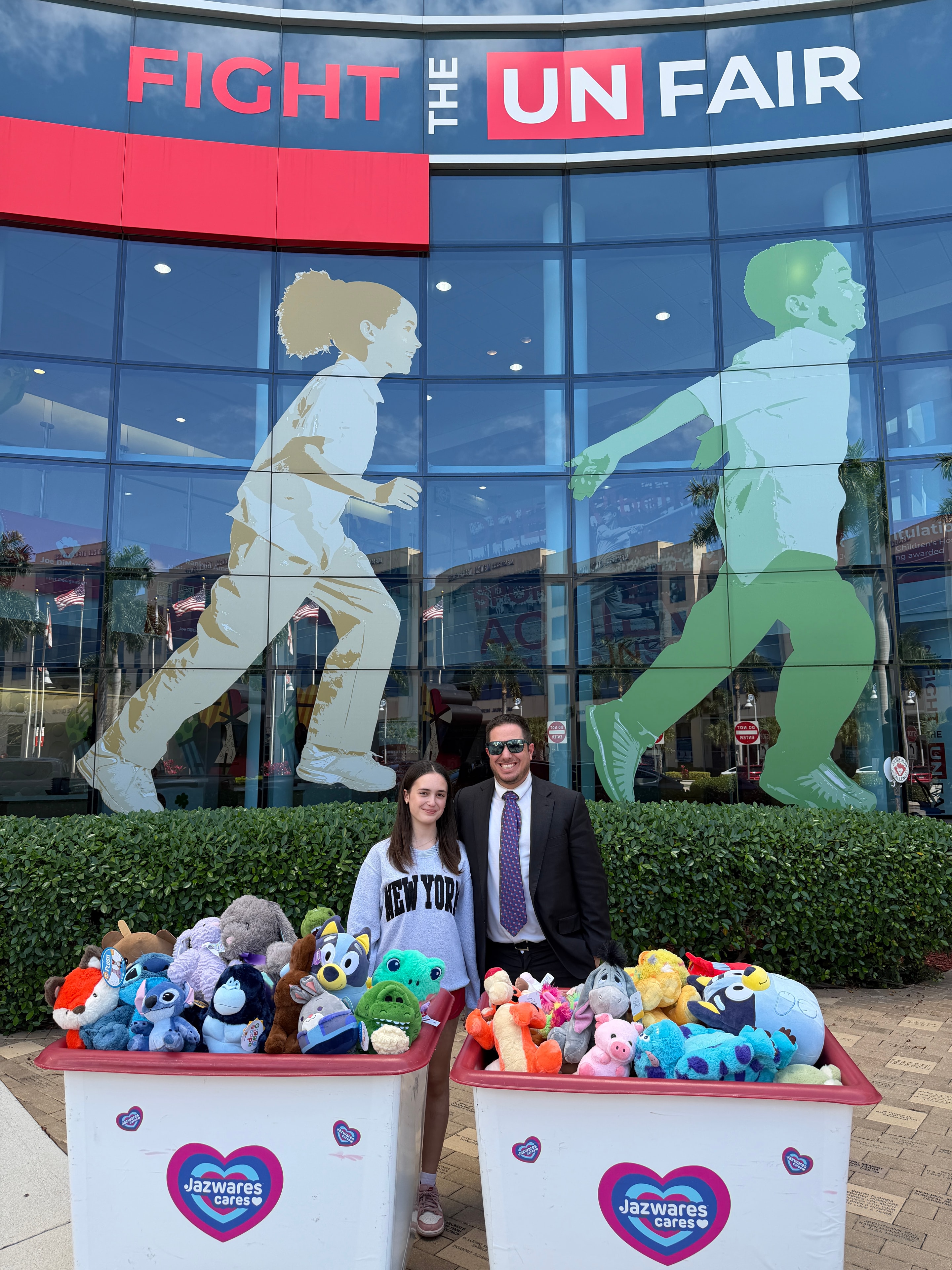 Posing with the stuffed animal donation display at Joe DiMaggio Children's Hospital
