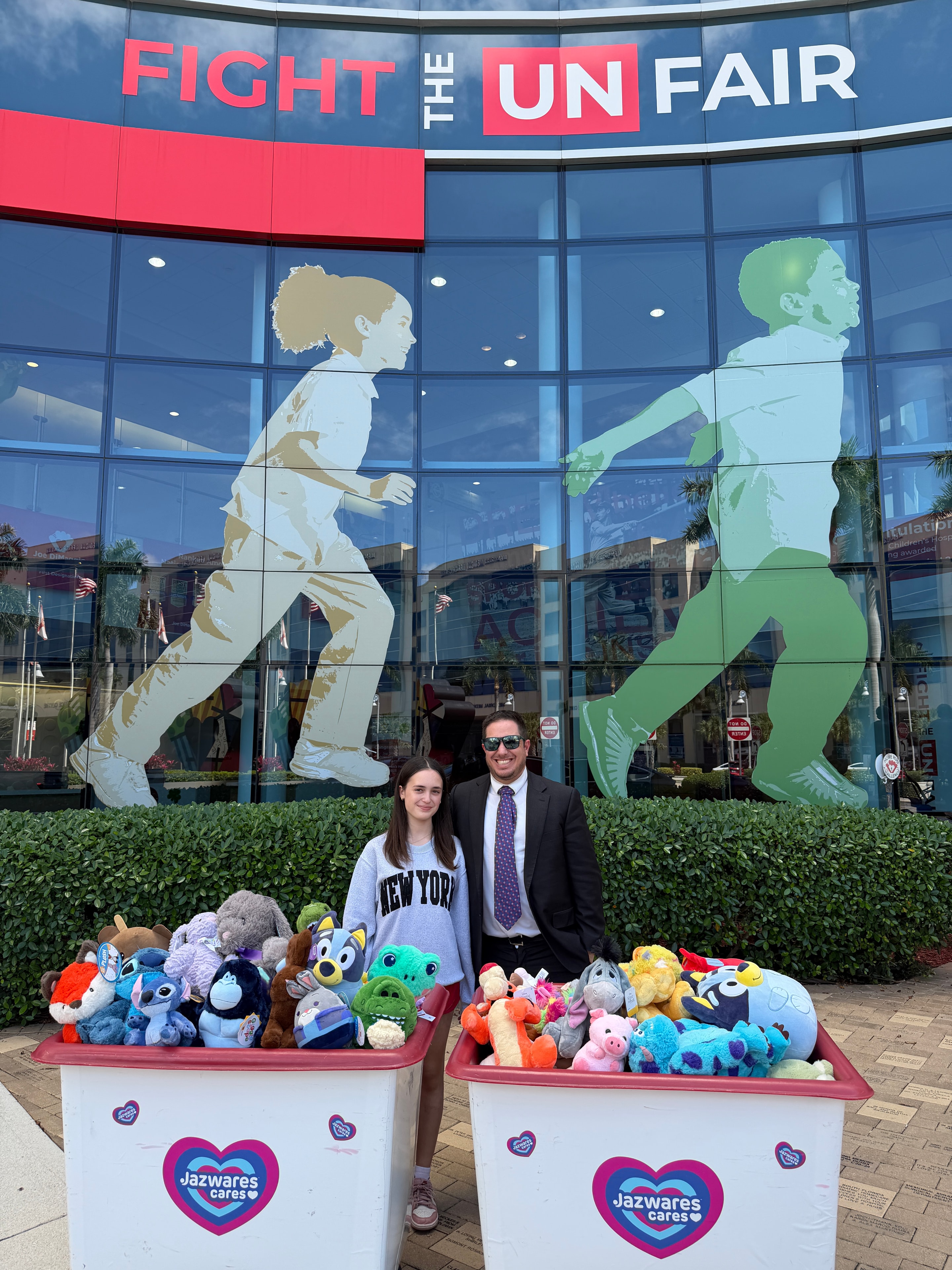 Posing with the stuffed animal donation display at Joe DiMaggio Children's Hospital